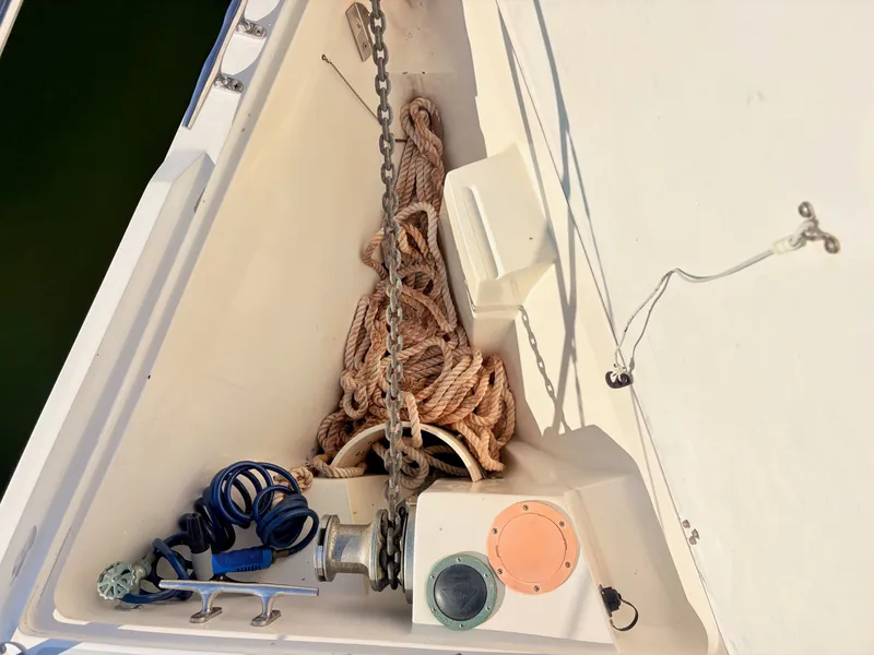 Slide: The Image of The bow of a 1994 Catalina 42 features anchor chains and ropes. - 14
