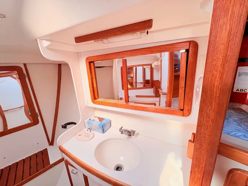 Slide: The Image of Interior of a 1994 Catalina 42 with wood trim and a sink. - 27
