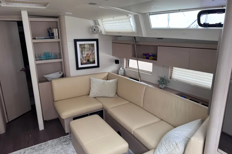 Slide: The Image of Luxurious interior of 2022 Beneteau Oceanis 46.1 yacht with beige seating and modern decor. - 20