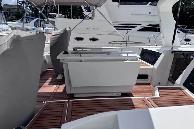 Slide: The Image of Beneteau Oceanis 46.1 yacht deck, 2022 model, featuring sleek design and wooden flooring. - 5