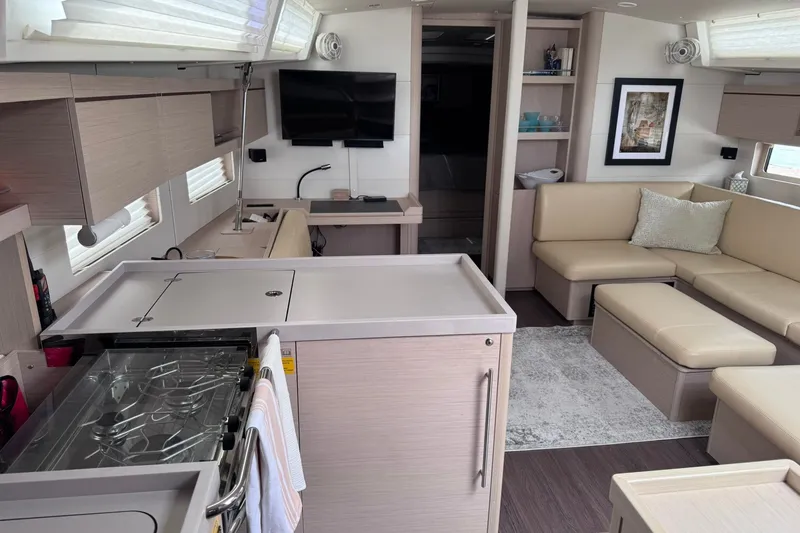 Slide: The Image of Luxurious interior of 2022 Beneteau Oceanis 46.1 yacht with modern kitchen and seating area. - 23