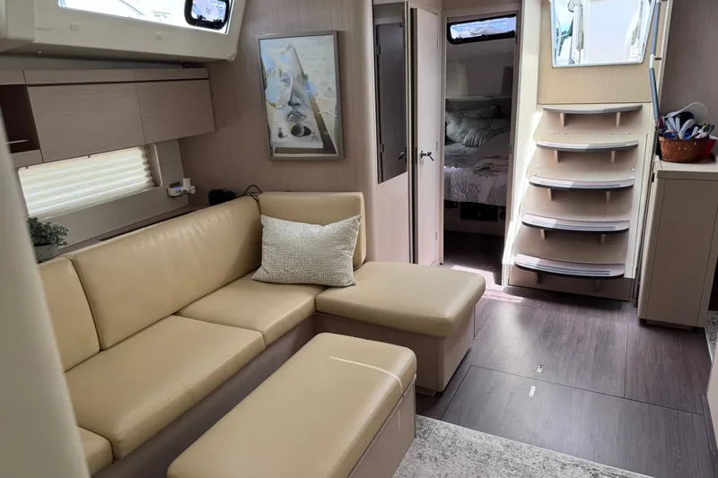 Slide: The Image of Luxurious interior of 2022 Beneteau Oceanis 46.1 yacht with beige seating and modern decor. - 38