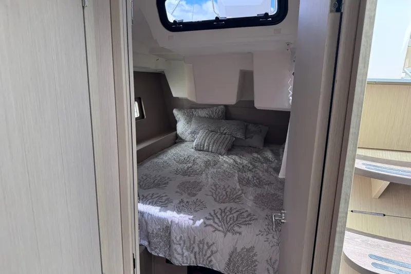 Slide: The Image of Cozy cabin interior of 2022 Beneteau Oceanis 46.1 yacht with comfortable bedding. - 32