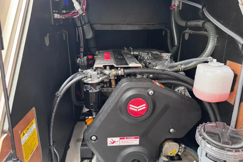 Slide: The Image of Engine compartment of a 2022 Beneteau Oceanis 46.1 sailboat, showcasing mechanical components. - 53