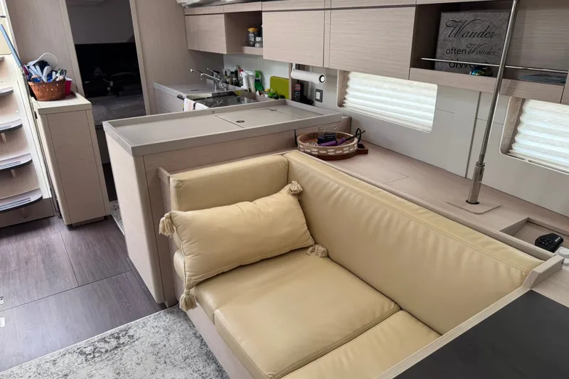 Slide: The Image of Interior of 2022 Beneteau Oceanis 46.1 yacht, featuring modern kitchen and cozy seating area. - 40