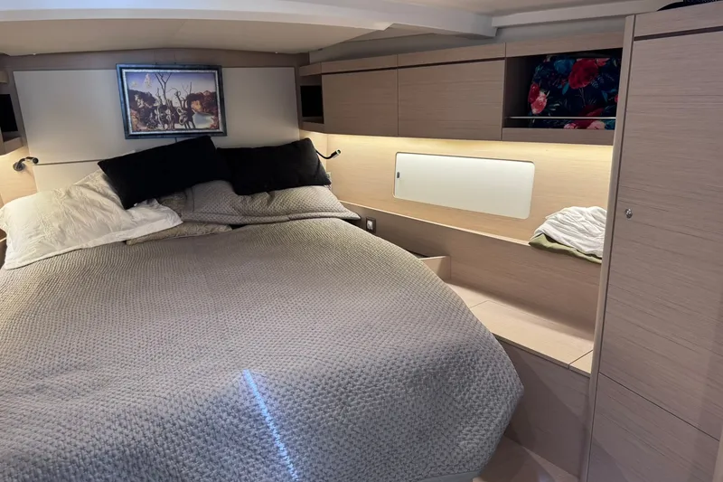 Slide: The Image of Luxurious cabin interior of 2022 Beneteau Oceanis 46.1 yacht with cozy bedding. - 27