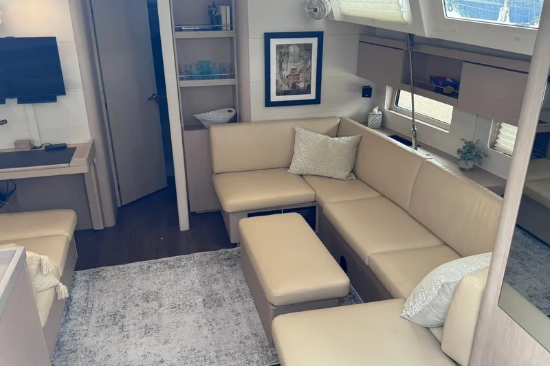 Slide: The Image of Luxurious interior of 2022 Beneteau Oceanis 46.1 yacht with beige seating and modern decor. - 37
