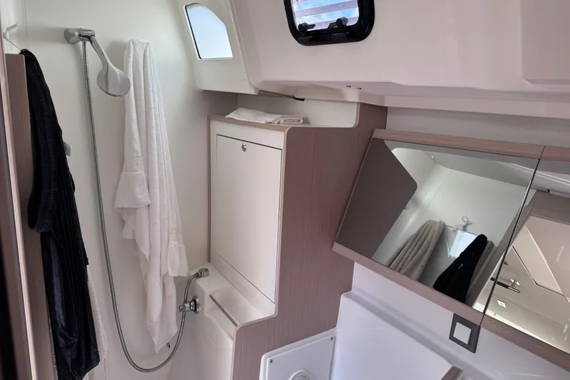 Slide: The Image of Bathroom interior of 2022 Beneteau Oceanis 46.1 yacht, featuring shower and mirror. - 34