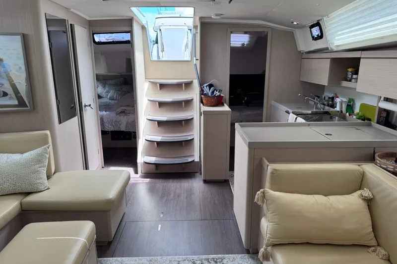 Slide: The Image of Interior of 2022 Beneteau Oceanis 46.1 yacht, featuring modern kitchen and cozy seating area. - 39