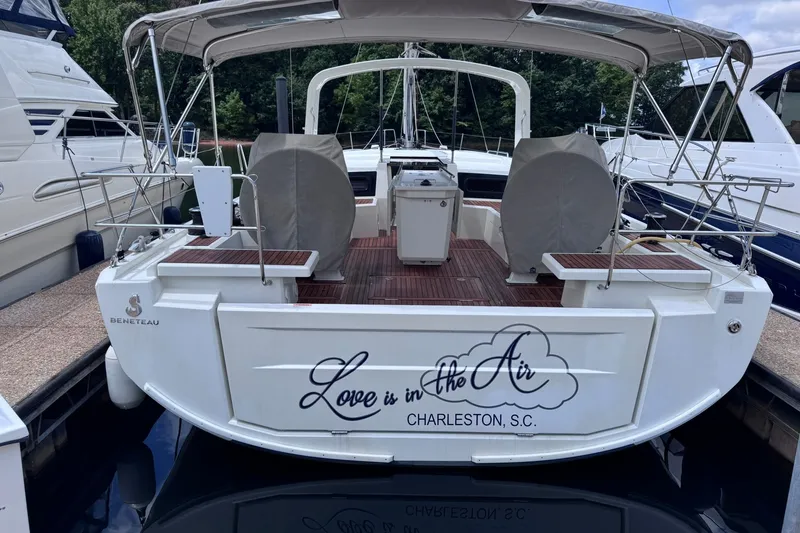 Slide: The Image of Beneteau Oceanis 46.1 yacht, 2022 model, docked in Charleston, S.C., with "Love is in the Air" text. - 2