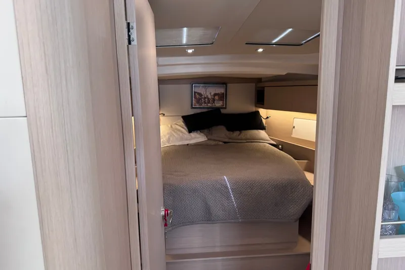 Slide: The Image of Cozy bedroom interior of 2022 Beneteau Oceanis 46.1 yacht with modern design. - 25