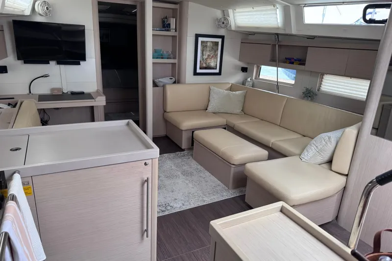 Slide: The Image of Luxurious interior of 2022 Beneteau Oceanis 46.1 yacht with modern furnishings and cozy seating. - 24