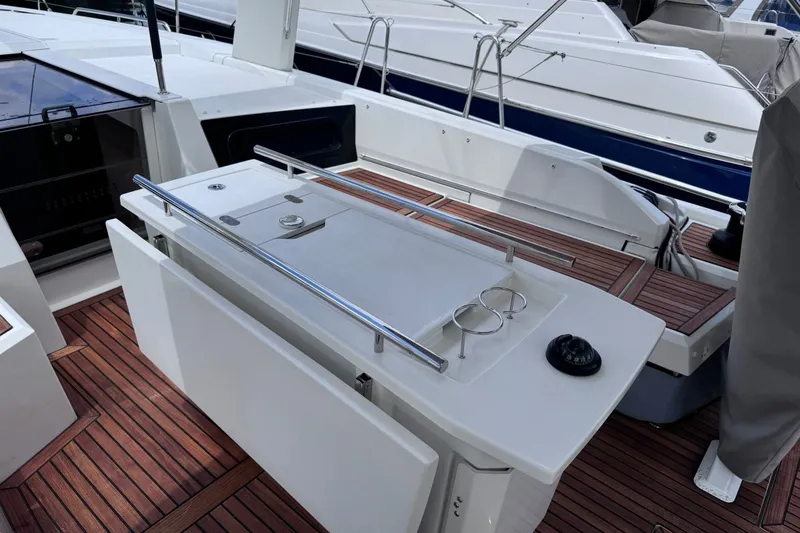 Slide: The Image of Cockpit of 2022 Beneteau Oceanis 46.1 yacht with wooden deck and sleek design. - 12