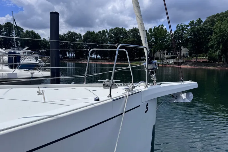 Slide: The Image of Beneteau Oceanis 46.1 sailboat docked on a calm lake, 2022 model. - 6