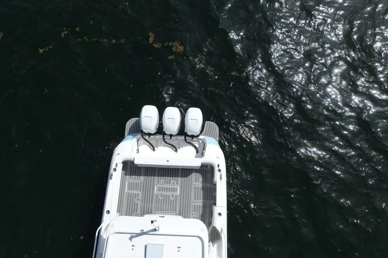 Slide: The Image of Aerial view of 2017 Intrepid 430 Sport Yacht with triple engines on dark water. - 62