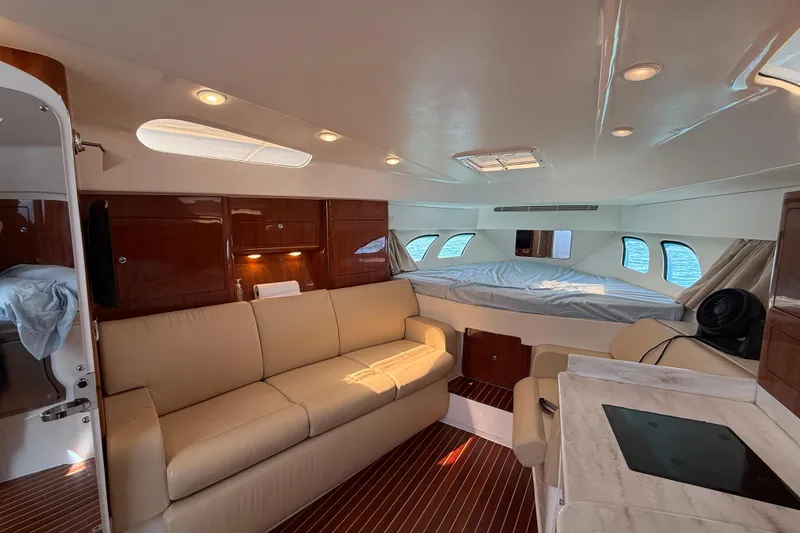 Slide: The Image of Luxurious interior of 2017 Intrepid 430 Sport Yacht with beige seating and wood accents. - 19