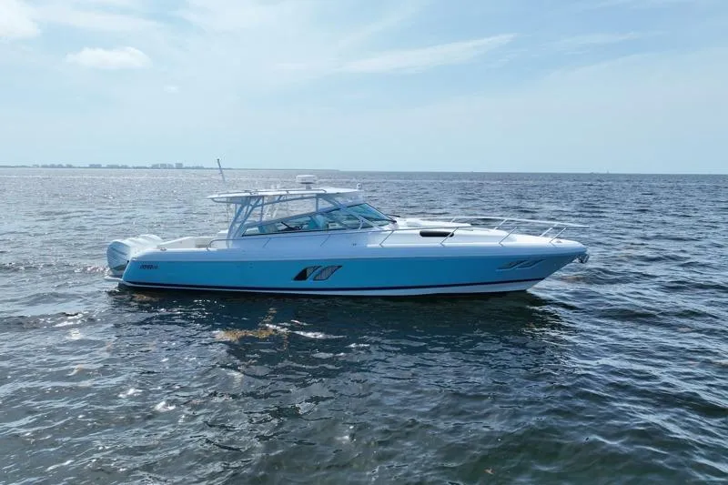 The Image of 2017 Intrepid 430 Sport Yacht cruising on open water under clear skies. - 0