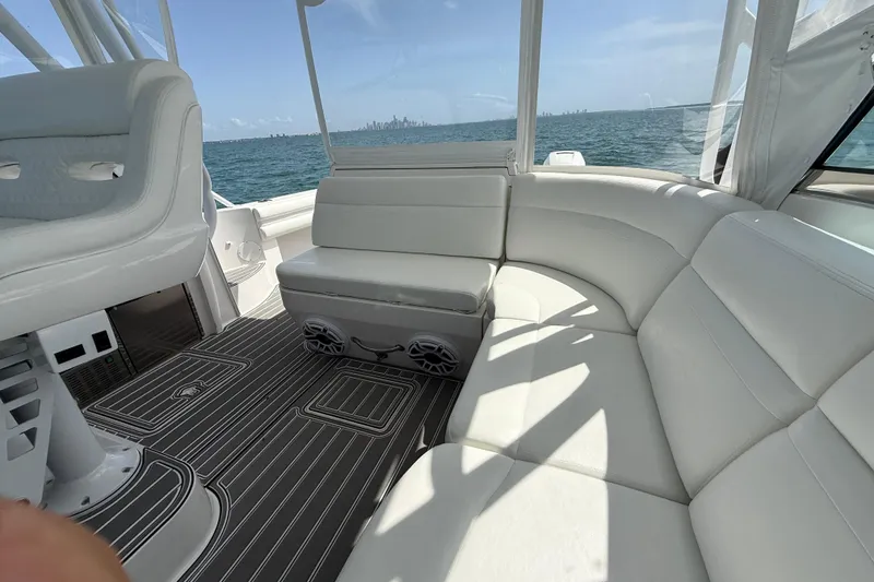 Slide: The Image of Luxurious interior of 2017 Intrepid 430 Sport Yacht with white seating and ocean view. - 43
