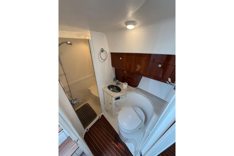 Slide: The Image of Luxurious bathroom in 2017 Intrepid 430 Sport Yacht with shower and wooden accents. - 23