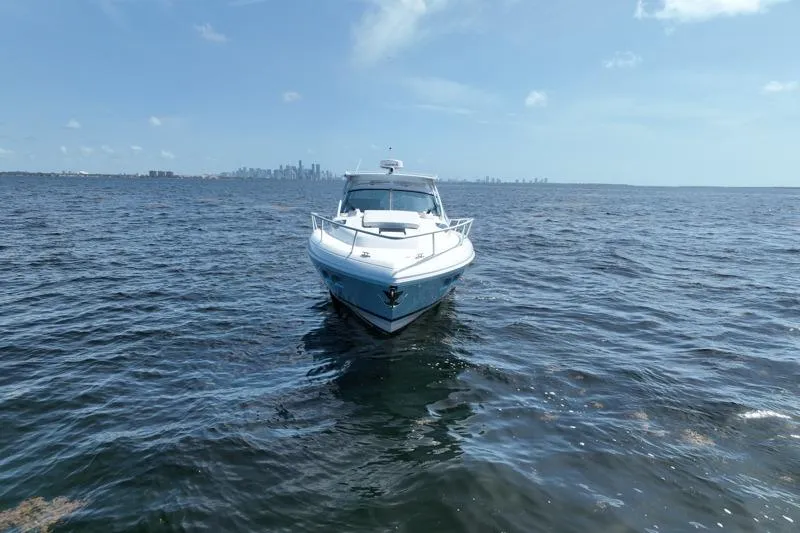Slide: The Image of 2017 Intrepid 430 Sport Yacht on open water with city skyline in background. - 3