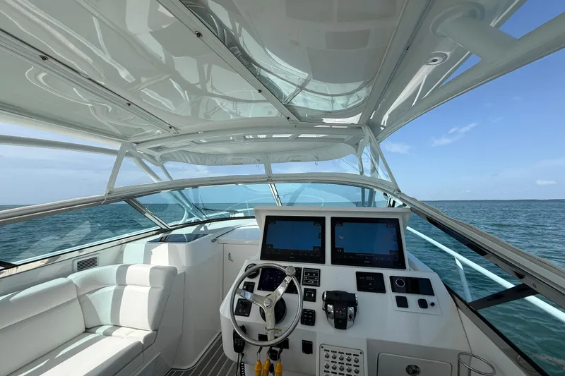 Slide: The Image of Cockpit view of 2017 Intrepid 430 Sport Yacht with dual screens and ocean backdrop. - 35