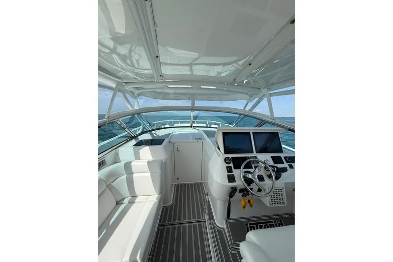 Slide: The Image of Interior view of 2017 Intrepid 430 Sport Yacht cockpit with modern controls and seating. - 33