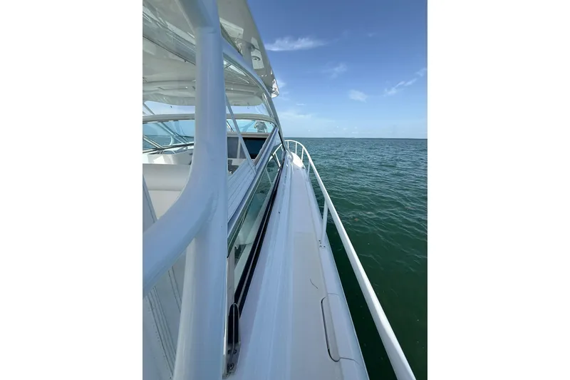 Slide: The Image of Side view of 2017 Intrepid 430 Sport Yacht cruising on open sea. - 56