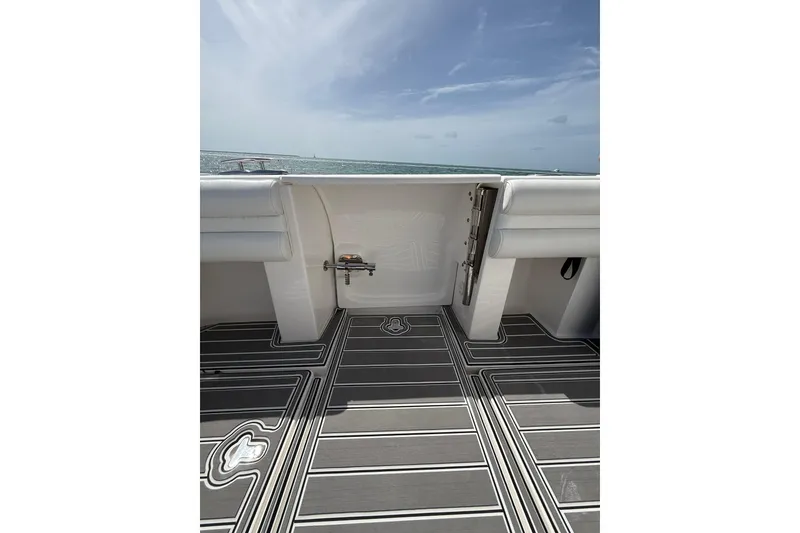 Slide: The Image of Intrepid 430 Sport Yacht 2017 deck view with ocean backdrop and sleek flooring design. - 50