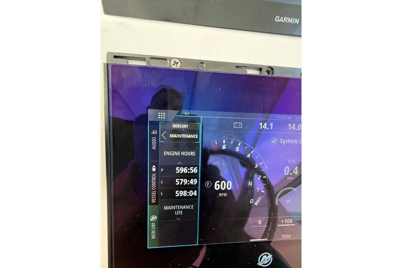 Slide: The Image of Display screen of a 2017 Intrepid 430 Sport Yacht showing engine hours and RPM. - 36