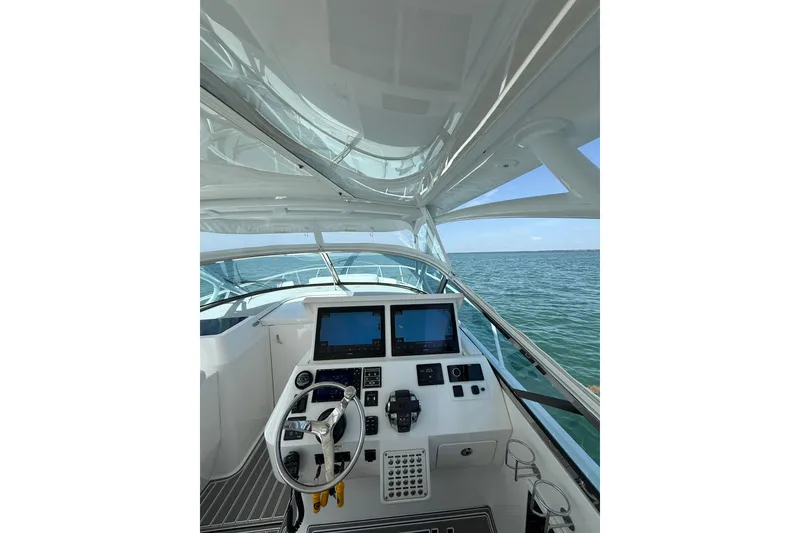 Slide: The Image of Cockpit view of 2017 Intrepid 430 Sport Yacht on open water. - 34