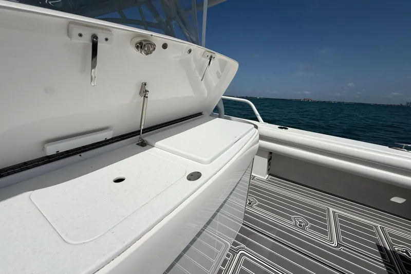 Slide: The Image of 2017 Intrepid 430 Sport Yacht deck with ocean view, featuring sleek design and modern amenities. - 52