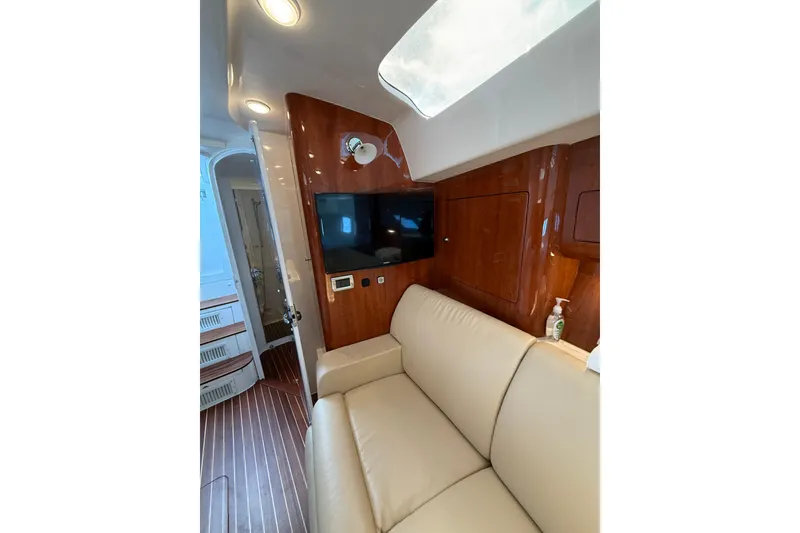Slide: The Image of Luxurious interior of 2017 Intrepid 430 Sport Yacht with leather seating and wood paneling. - 22