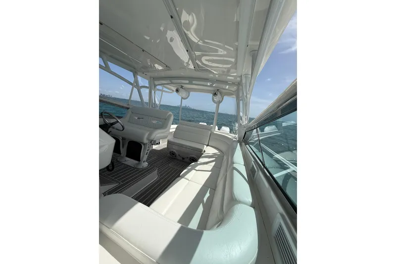 Slide: The Image of Interior view of 2017 Intrepid 430 Sport Yacht, featuring sleek seating and ocean backdrop. - 44