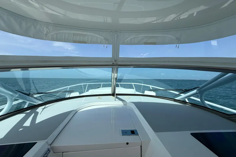 Slide: The Image of 2017 Intrepid 430 Sport Yacht cruising on open sea under clear skies. - 30