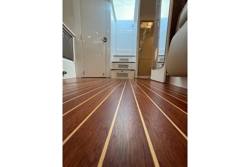 Slide: The Image of Luxurious wood flooring inside a 2017 Intrepid 430 Sport Yacht cabin. - 29