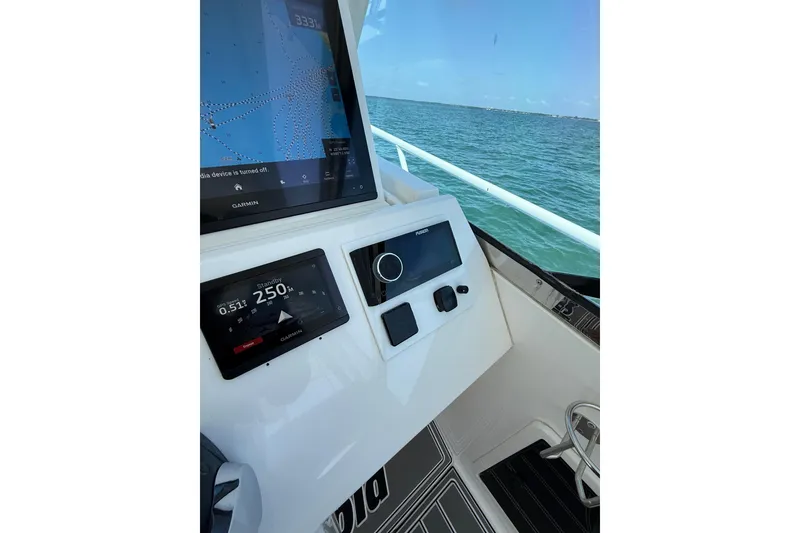 Slide: The Image of 2017 Intrepid 430 Sport Yacht helm with Garmin navigation system, ocean view. - 39