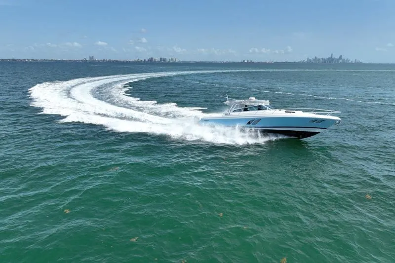 Slide: The Image of 2017 Intrepid 430 Sport Yacht cruising swiftly on open water. - 12