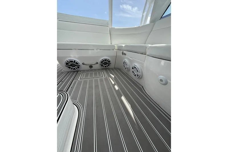 Slide: The Image of 2017 Intrepid 430 Sport Yacht interior with sleek seating and modern flooring design. - 47