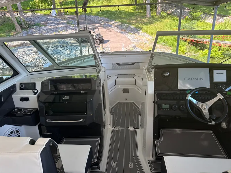 Slide: The Image of The cockpit of the 2024 Blackfin 272 DC features a modern helm with Garmin navigation. - 5