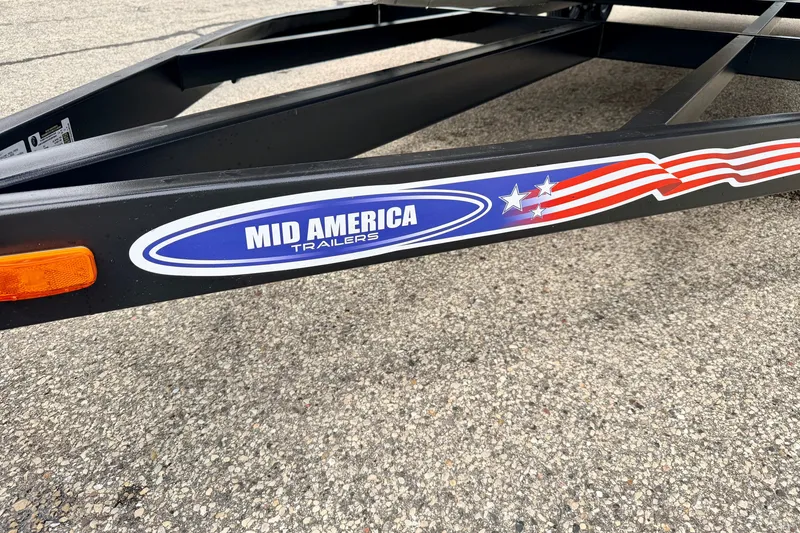 Slide: The Image of Trailer frame with "Mid America Trailers" logo, featuring stars and stripes design. - 98