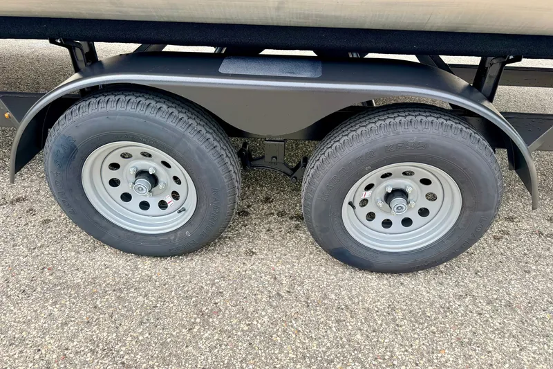 Slide: The Image of Trailer wheels of a 2015 Manitou 25 SES BENCH on asphalt surface. - 102