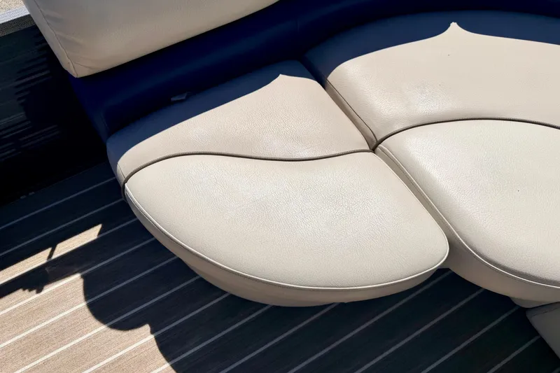Slide: The Image of 2015 Manitou 25 SES BENCH with beige leather seating on striped flooring. - 56