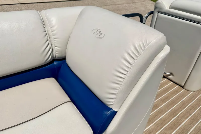 Slide: The Image of 2015 Manitou 25 SES BENCH boat seat with white and blue upholstery. - 64
