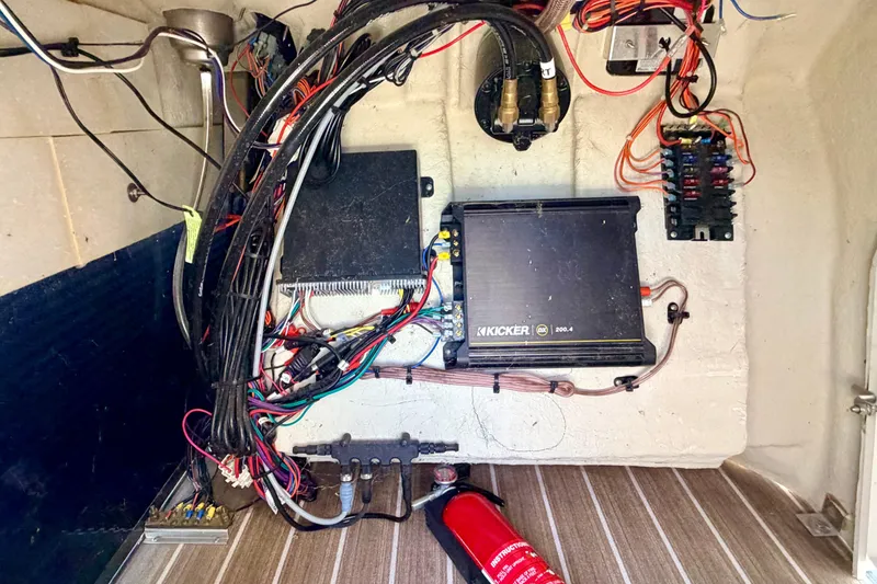 Slide: The Image of Electrical wiring and components inside a 2015 Manitou 25 SES BENCH boat. - 33