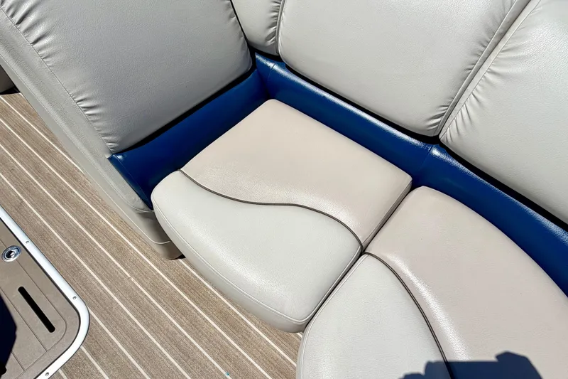 Slide: The Image of 2015 Manitou 25 SES BENCH boat seat with beige and blue upholstery. - 37