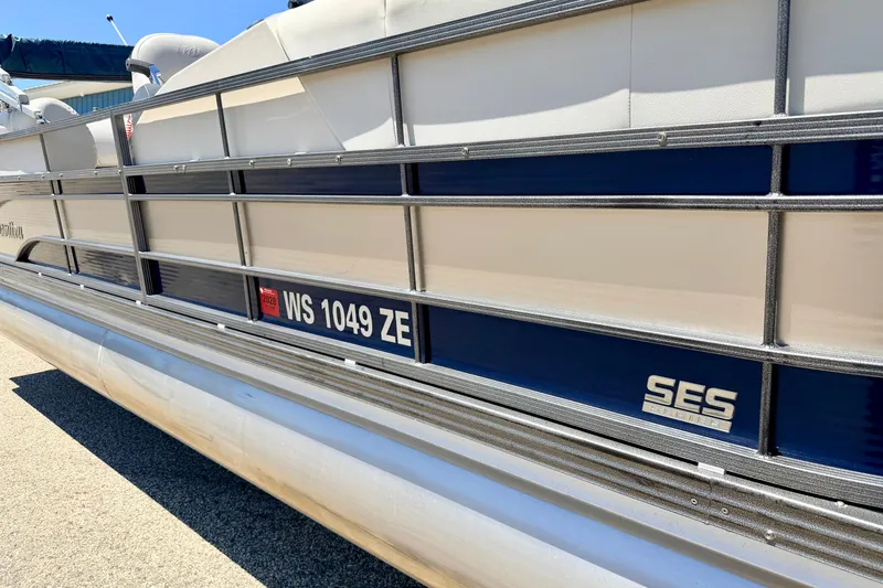 Slide: The Image of 2015 Manitou 25 SES BENCH pontoon boat side view with registration number. - 6