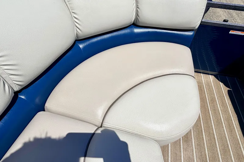 Slide: The Image of 2015 Manitou 25 SES BENCH boat seating with white and blue upholstery. - 35