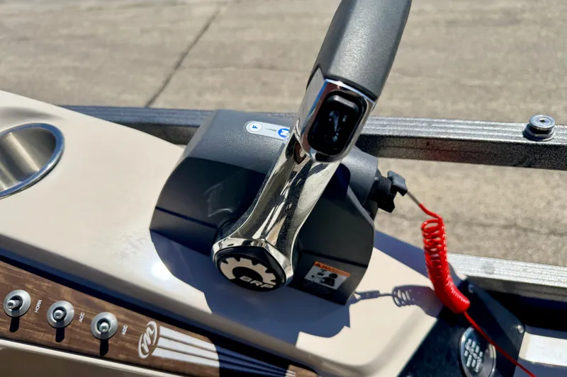 Slide: The Image of Control panel of a 2015 Manitou 25 SES BENCH boat with throttle and buttons. - 51