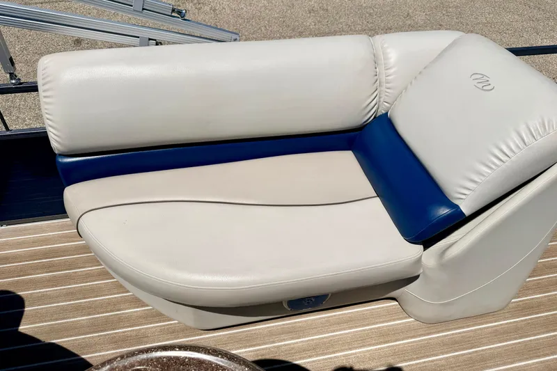 Slide: The Image of 2015 Manitou 25 SES BENCH boat seat with white and blue upholstery. - 62