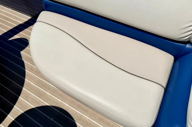 Slide: The Image of 2015 Manitou 25 SES BENCH seat with beige and blue upholstery on striped flooring. - 65